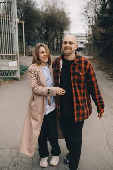 Loving caucasian blond couple walking at street