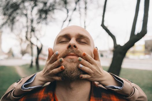 girl closes her lover's eyes from behind. hipster