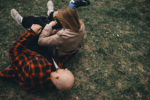 young couple laying on grass. summer love outdoors