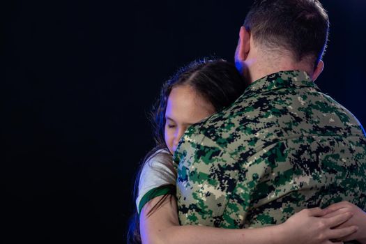 Soldier hugs daughter on departing or returning from war