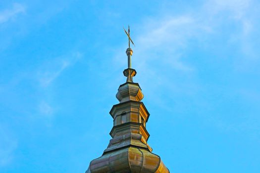 Against the background of the blue sky, the dome of the church or church