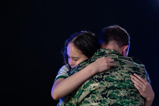 Soldier hugs daughter on departing or returning from war