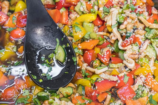 vegetable salad coarsely with a spoon as a background. photo