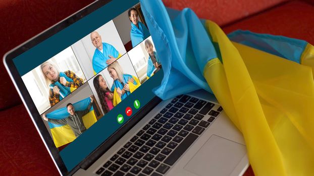 laptop near the ukraine flag. online conference.