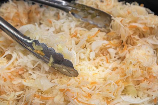 sauerkraut salad close-up top view as background. photo