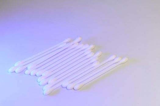 an absorbent pad or piece of material used in surgery and medicine for cleaning wounds, applying medication, or taking specimens.Cotton swabs for ear hygiene and other.