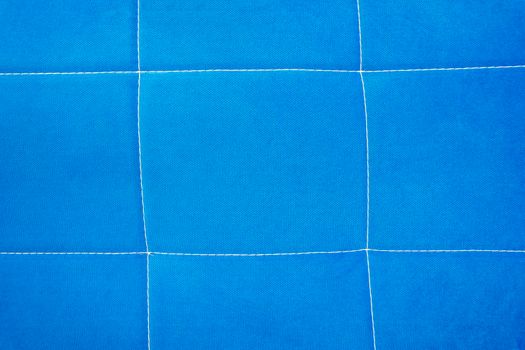 blue fabric backgroundbackground of blue fabric with stitching. sofa upholstery, furniture