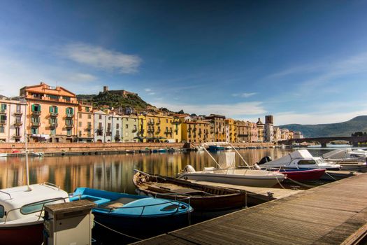 Temo river in Bosa a town in Sardegna Italy with houses reflection on the water