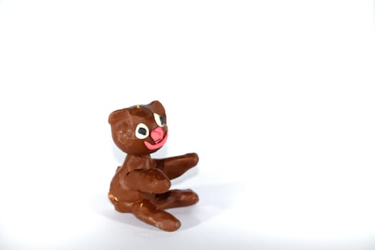 Plasticine bear. Toys made of plasticine on a white background.
