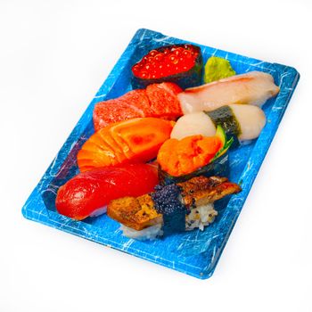 take away selection of fresh sushi express on plastic tray 