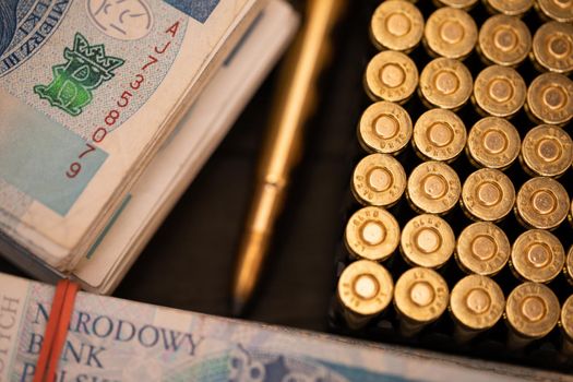 Sharp ammunition for pistol and rifle lies on a table during a business transaction. Selling ammunition to soldiers fighting at the front.