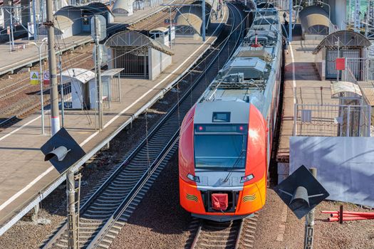 A modern high-speed train stands at the station.