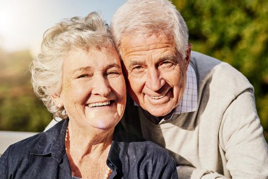 Shot of a happy senior couple relaxing together outdoors.