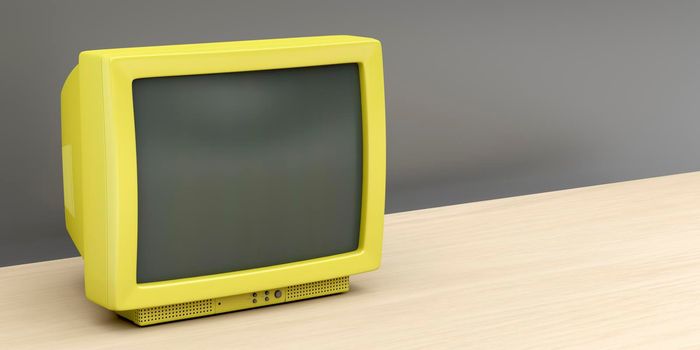 Yellow retro tv on wooden stand