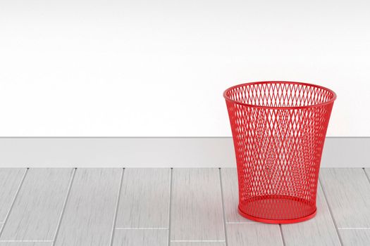Empty red wastepaper basket in the office