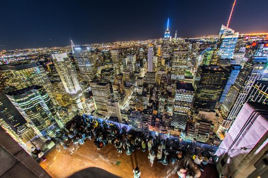 People looking at night view from Rockefeller Center Observatory (Top of the Rock) 7. Shooting Location: New York, Manhattan