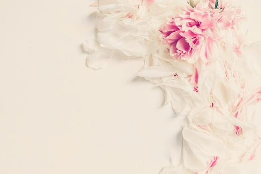 Abstract Border of Beautiful pink and white peony flowers on wooden table with copy space for your text top view and flat lay style.