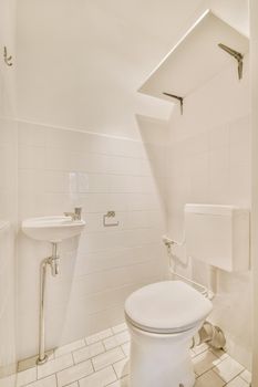 Modern white toilet with ceramic walls and tiles