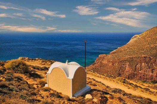 Small white church with dome in Anafi island