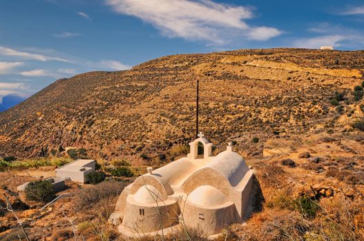 Small white church with dome in Anafi island