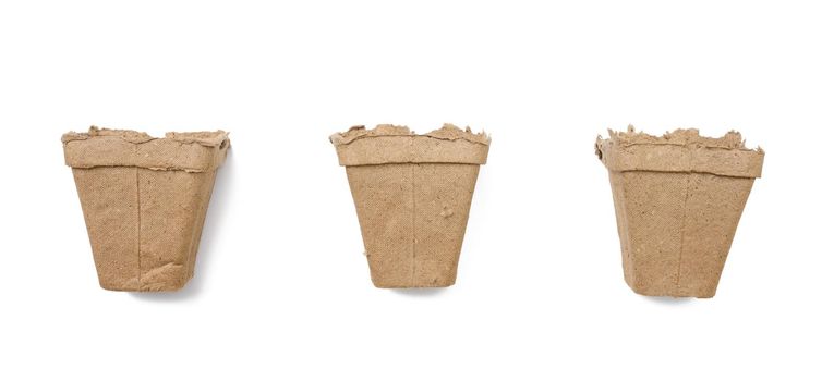 Empty paper pots for planting seed on white isolated background, set