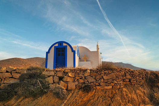 Small white church with dome in Anafi island