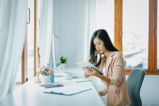 data analysis, plan, marketing, accounting, audit, Portrait of asian business woman planning marketing using tablet and computer to present marketing plan project at meeting