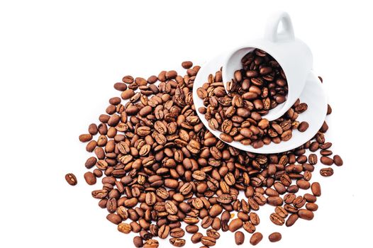 white cup with coffee beans isolated