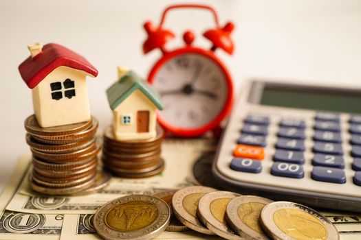 House on coins money, saving bank, real estate investment, 
installment payment, home loan interest.