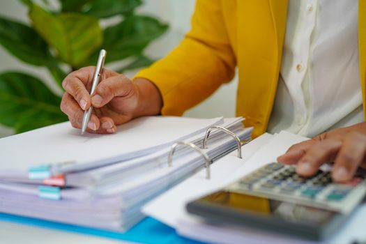 Businessman working and prepare paperwork report data to analysis information in file binder at office.         