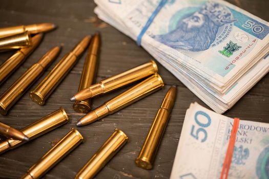 The ammunition is lying on a chest right next to paper bills with the face value of fifty zlotys. Essential accessories of every fighting soldier at the front.