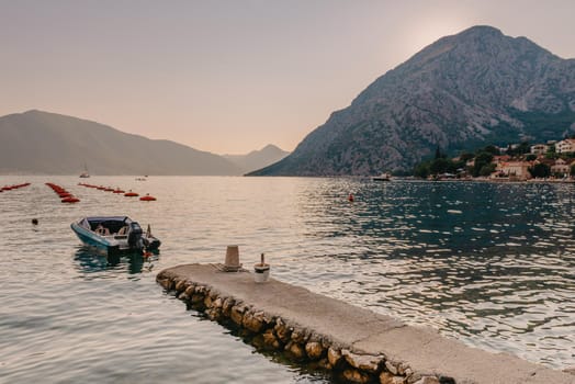 Fishing boat on an oyster farm in the Bay of Kotor, Montenegro. High quality photo.