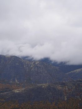 The clouds caught on the tops of the mountains. Low clouds in the mountains. Khibiny, Russia. photo