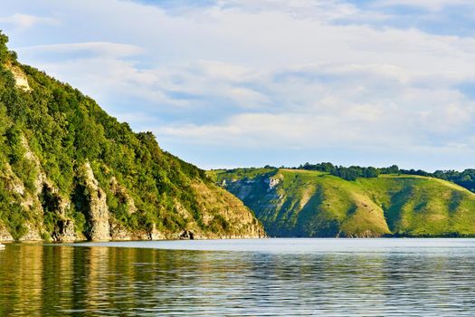 a large natural stream of water flowing in a channel to the sea, a lake, or another such stream.