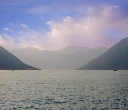 Sunset, beautiful landscape with silhouettes of trees. Travel concept. Montenegro, Kotor Bay. Sunset at Kotor Bay Montenegro. View of the sunset in Boko-Kotor Bay in Montenegro. Silhouettes of mountains. High quality photo