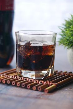 soft drinks with ice on table .