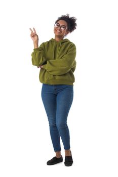 Photo portrait of cheerful mixed race woman showing v-sign gesture isolated on white background