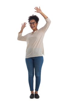 Full length portrait of a cheerful young mixed race woman with arms raised isolated on white background