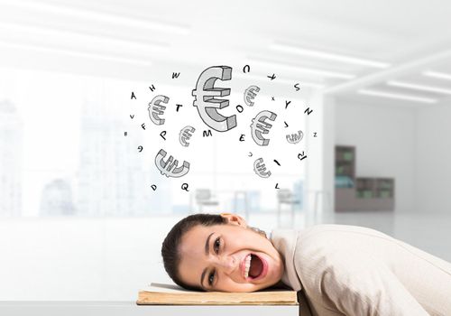 Business woman lying on desk with open mouth. Young tired manager in white business suit relaxing in light office interior. Euro currency signs flying above head. Financial profit and investment