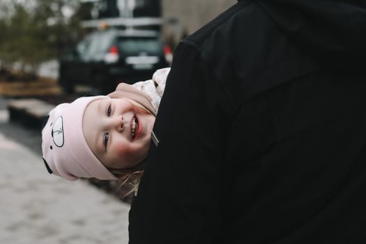 Happy emotional girl with father. Family having fun outdoors. Father and daughter together.