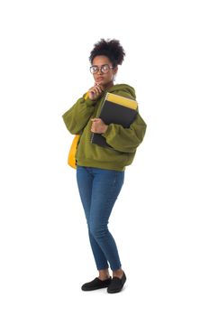 Friendly ethnic black female high school student in eyeglasses with backpack and composition book isolated on white background, full length portrait