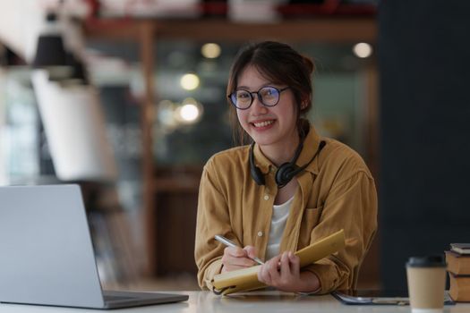 E-learning ,online ,education and internet social distancing protect from COVID-19 viruses concept. Asian woman student video conference e-learning with teacher on digital tablet at home
