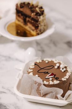 Three different bento cake on white table. Small bento cake for one person as a gift for the holiday.