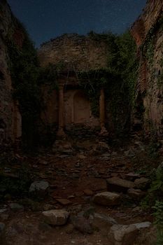 Jinquer, Castellon, Spain. Interior of destroyed church in abandoned village. Altar, starry sky columns, lonely, terror fear. Spanish Civil War