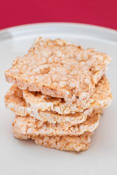 A Stack of Square Rice Cakes on White Plate. Dietary Crispbread