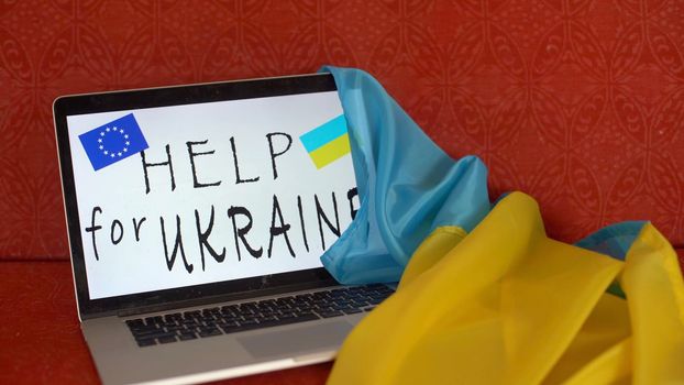 flag of Ukraine with screen laptop, war in Ukraine, patriot, template, peace in Ukraine, laptop with white screen.