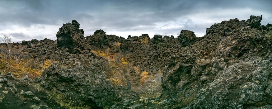 Vast Lava fields panorama under dark cloudy day