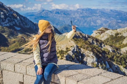 Woman traveller in mountain landscape at national park Lovcen, Montenegro. Travel to Montenegro concept.