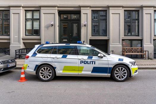 Copenhagen, Denmark. - March 1, 2022: Side view of a police car parked in a street.