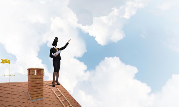 Faceless businesswoman with camera zoom instead of head standing on house roof